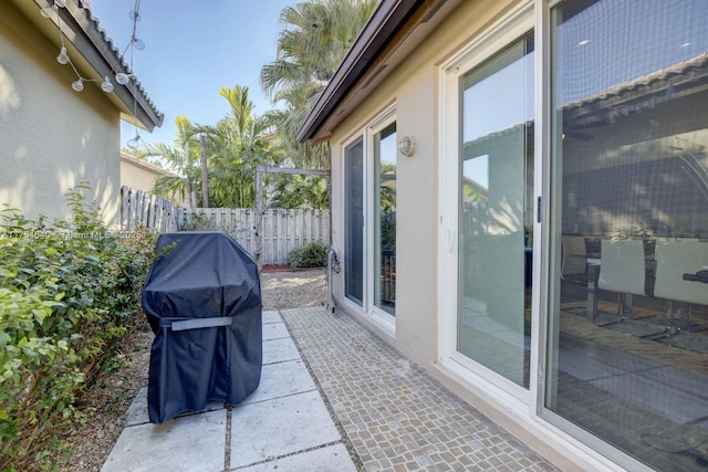 view of patio featuring a grill