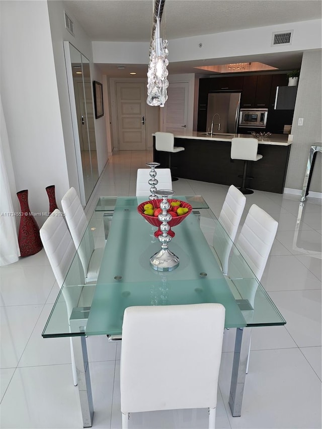 tiled dining area with sink