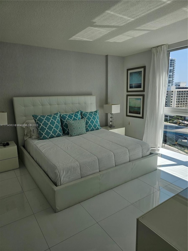 unfurnished bedroom with tile patterned floors and a textured ceiling