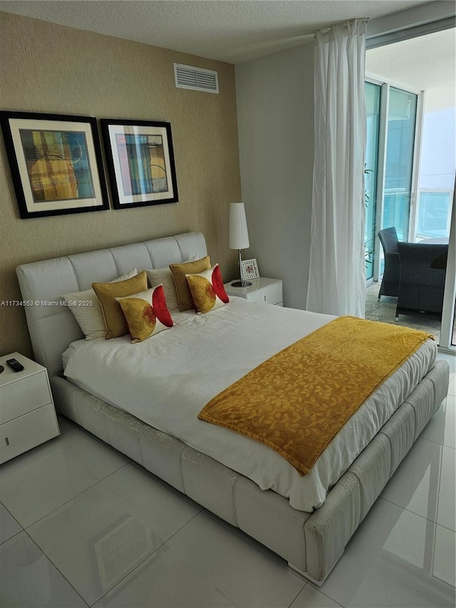 bedroom featuring a textured ceiling