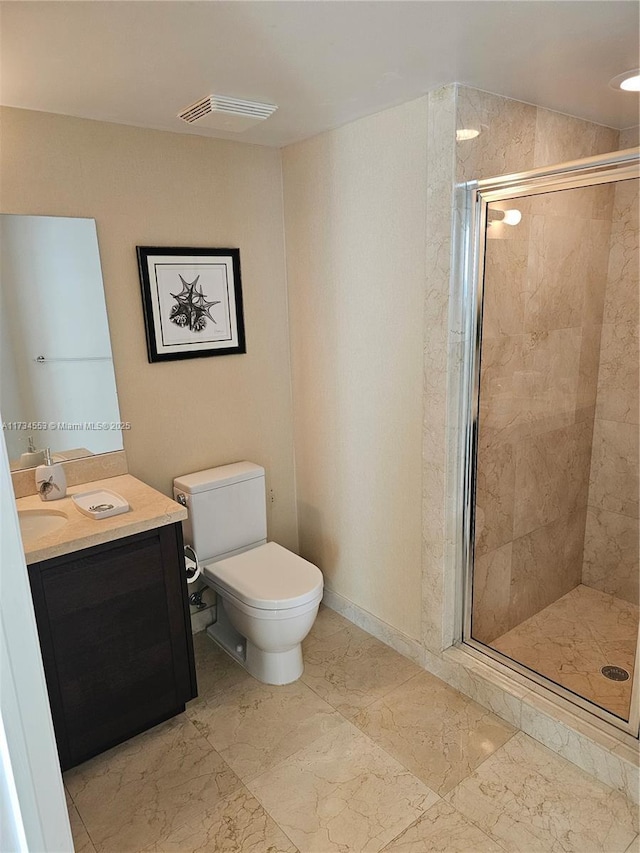 bathroom featuring toilet, vanity, and walk in shower