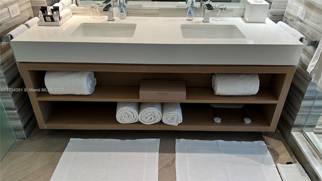 bathroom with hardwood / wood-style flooring and vanity