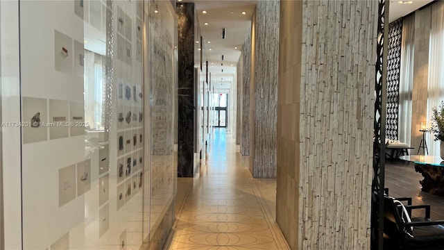 corridor featuring light tile patterned floors