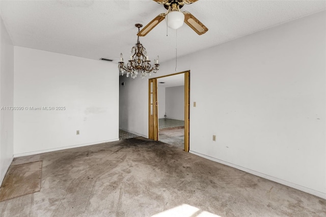 carpeted empty room with a textured ceiling and ceiling fan