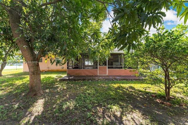 view of yard with a sunroom