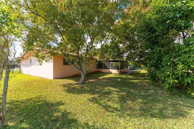 view of yard featuring a sunroom