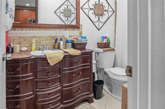 bathroom with vanity, backsplash, tile patterned floors, and toilet