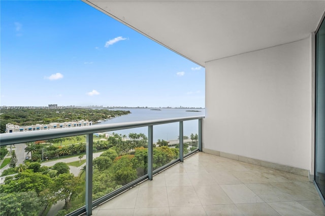 balcony featuring a water view