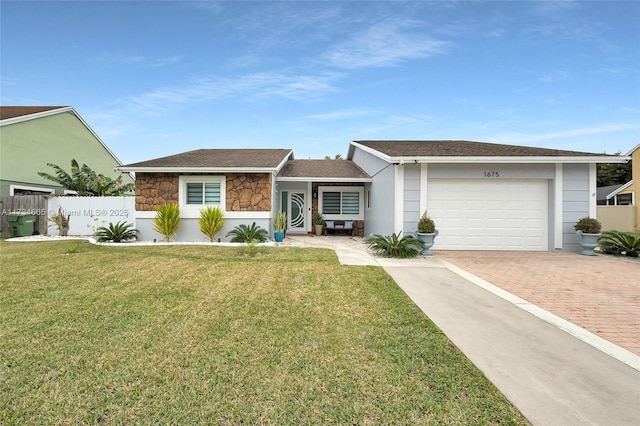 ranch-style house with a garage and a front yard