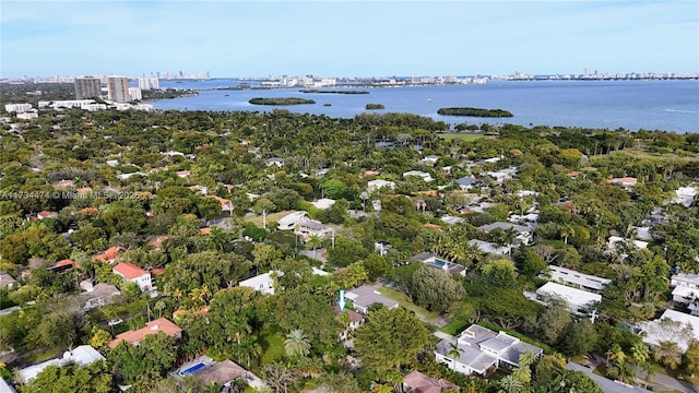 birds eye view of property featuring a water view and a city view