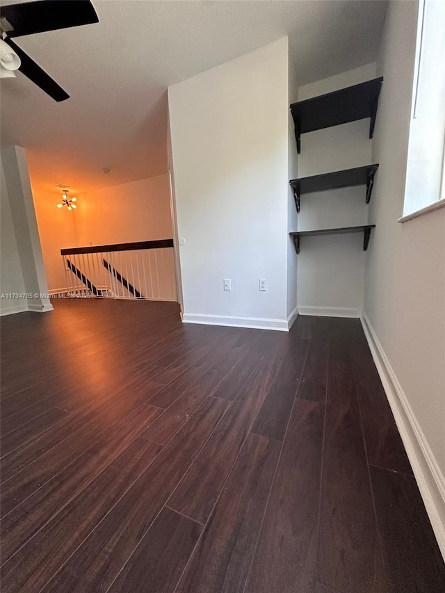 empty room featuring dark hardwood / wood-style floors and ceiling fan