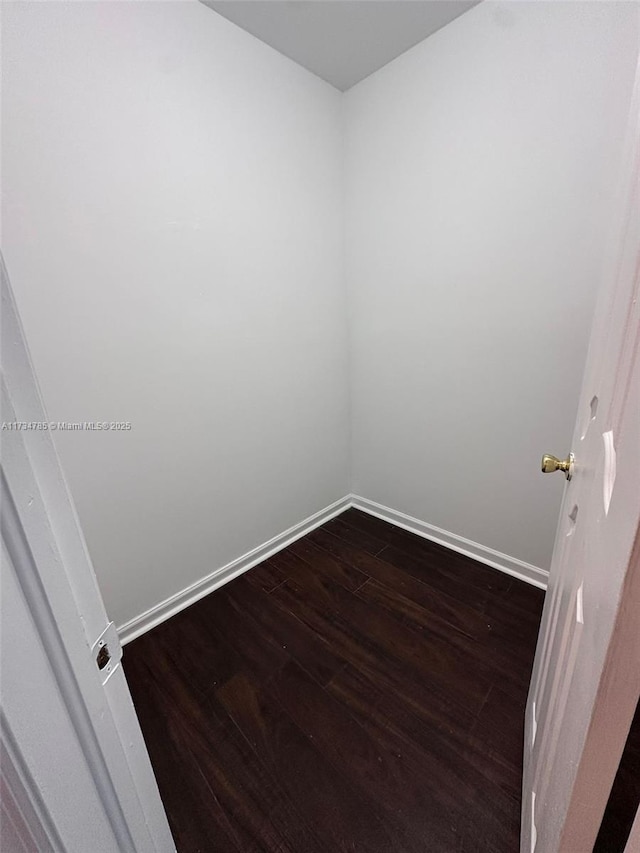 unfurnished room featuring hardwood / wood-style flooring