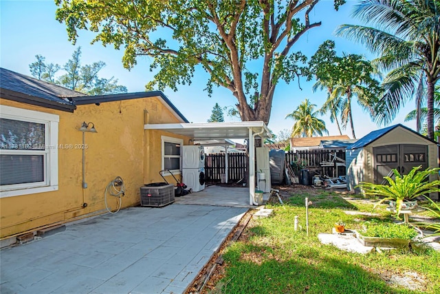 view of yard with cooling unit and a storage shed