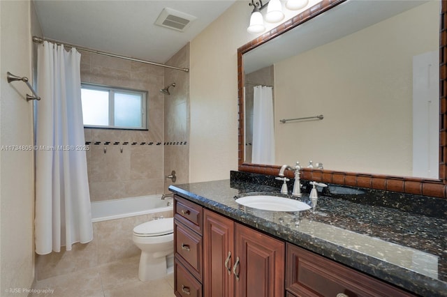 full bathroom with vanity, tile patterned flooring, toilet, and shower / tub combo with curtain