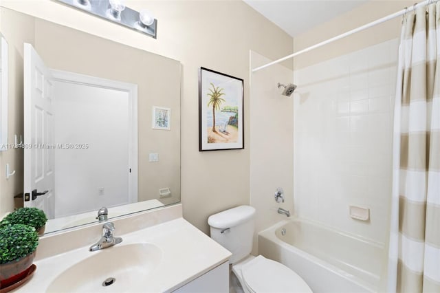 bathroom featuring shower / bath combo, vanity, and toilet