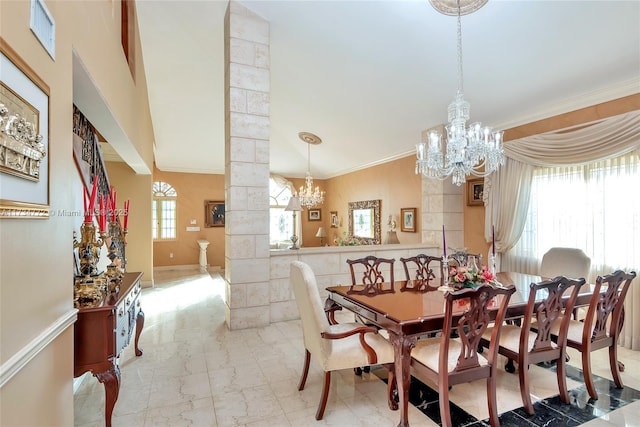 dining room featuring a notable chandelier, plenty of natural light, decorative columns, and ornamental molding