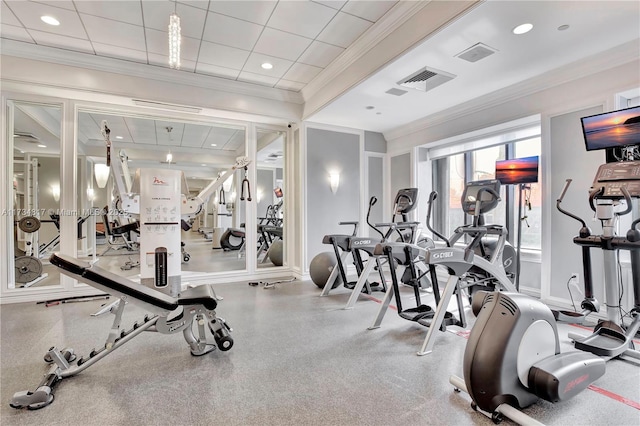 exercise room featuring crown molding