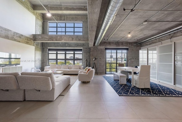 tiled living room with a high ceiling