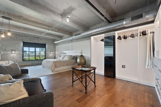 bedroom with wood-type flooring