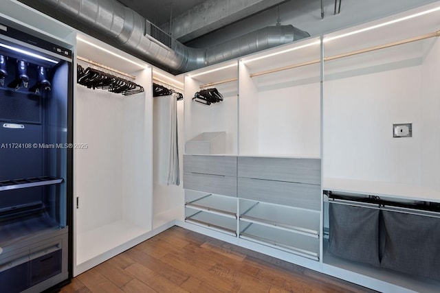 spacious closet featuring hardwood / wood-style flooring