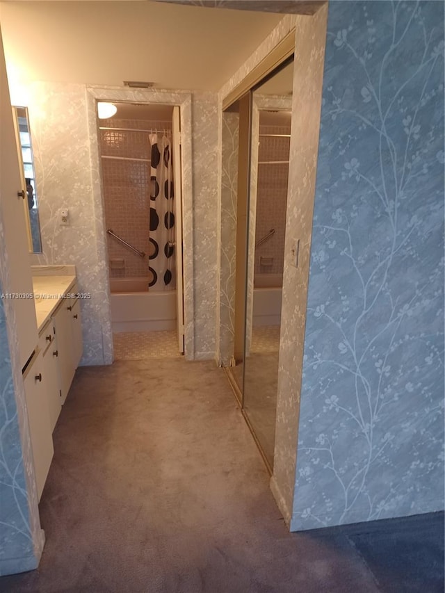 bathroom with vanity and shower / bath combo with shower curtain