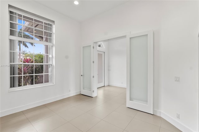 empty room with light tile patterned flooring