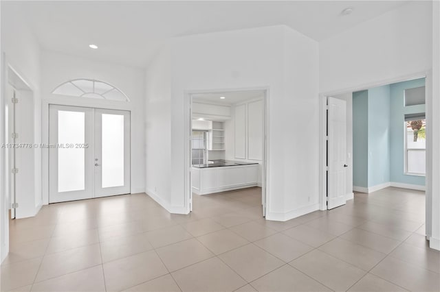 tiled entrance foyer with french doors