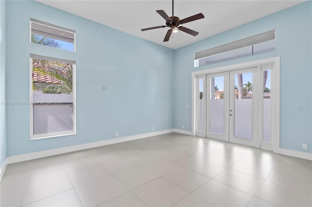 empty room featuring french doors and ceiling fan