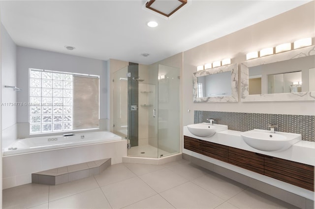 bathroom featuring vanity, independent shower and bath, and tile patterned flooring