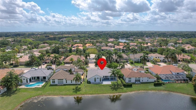 birds eye view of property featuring a water view