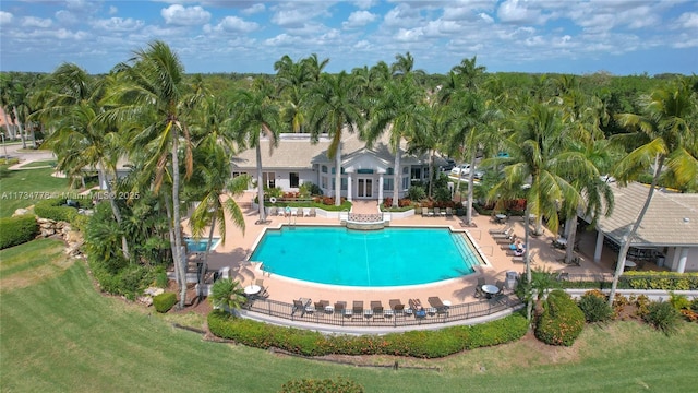 view of pool featuring a patio and a lawn