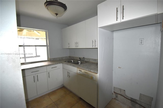 kitchen with tile patterned flooring, sink, white cabinets, and dishwasher