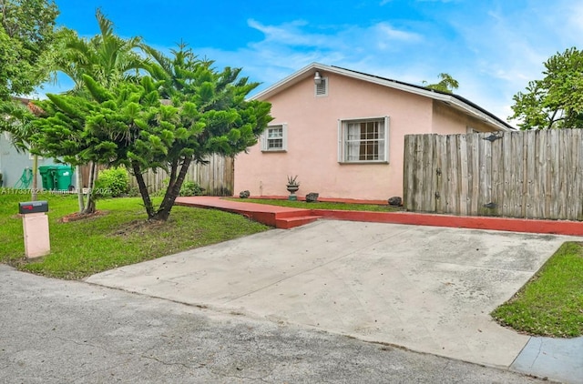 view of side of home with a patio area