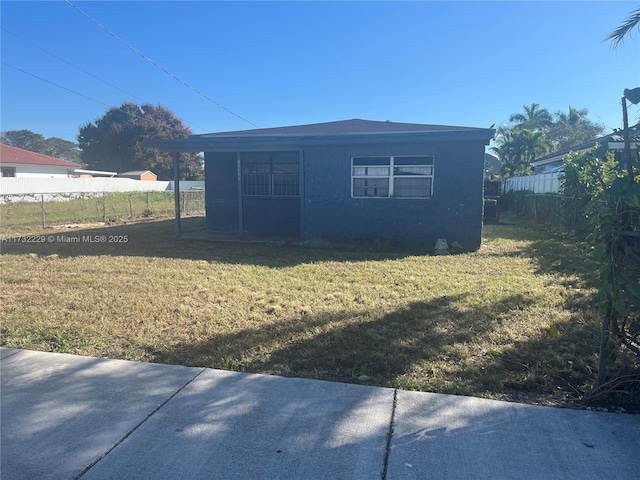 view of property exterior with a lawn