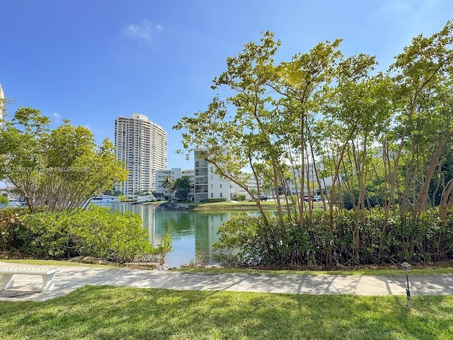 surrounding community featuring a water view