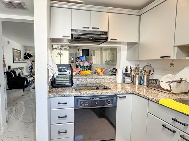 kitchen with extractor fan, white cabinets, light stone counters, and black appliances