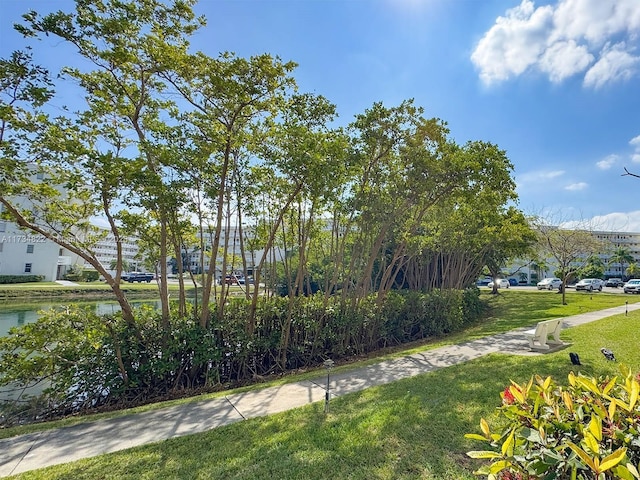 exterior space with a yard and a water view