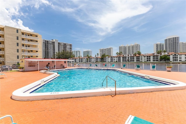 view of pool featuring a patio