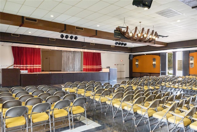 cinema featuring a paneled ceiling