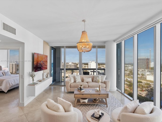 tiled living room with floor to ceiling windows and an inviting chandelier