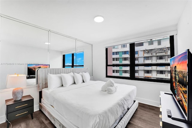 bedroom featuring dark hardwood / wood-style floors