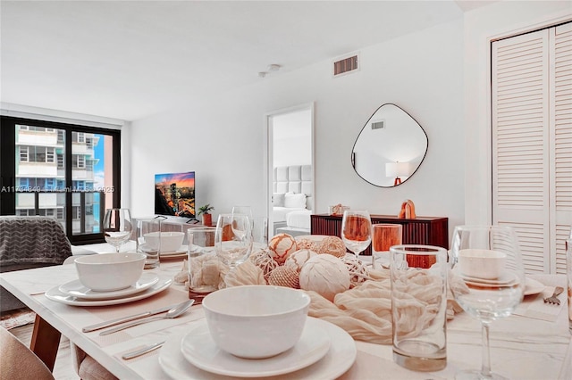 dining room featuring expansive windows