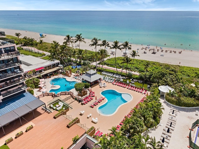 birds eye view of property featuring a view of the beach and a water view