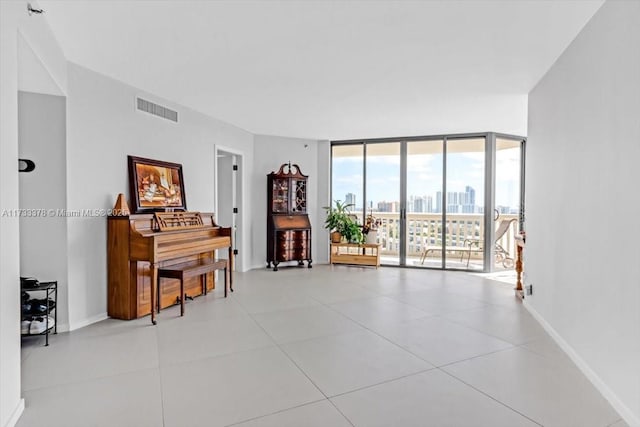 tiled living room featuring expansive windows