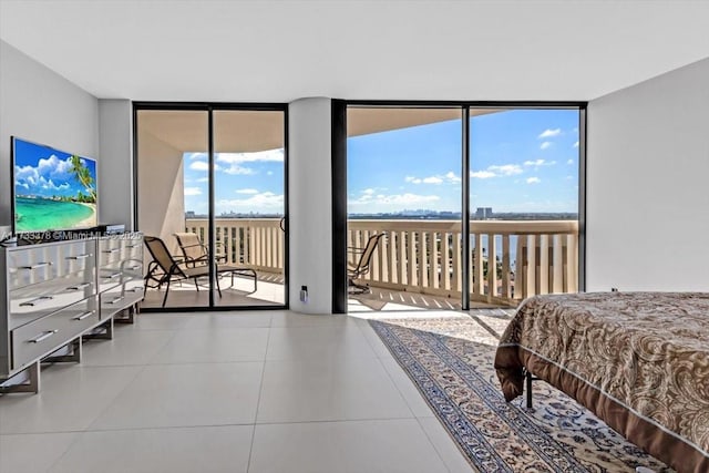 tiled bedroom featuring expansive windows and access to outside