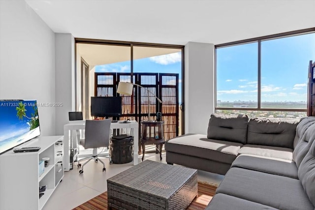 tiled living room with floor to ceiling windows