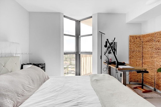 bedroom with floor to ceiling windows