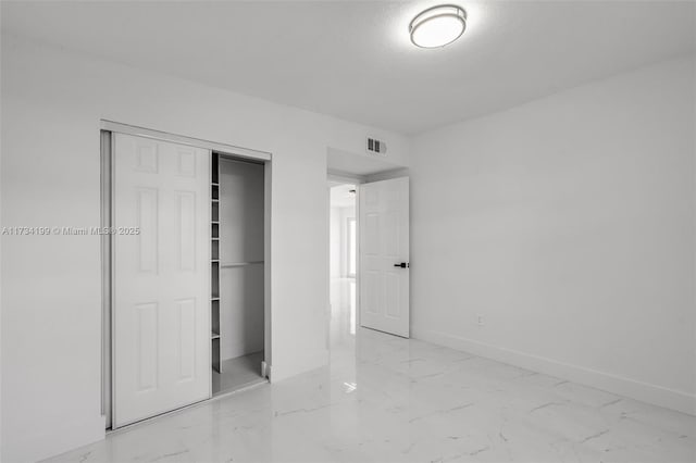 unfurnished bedroom featuring a closet