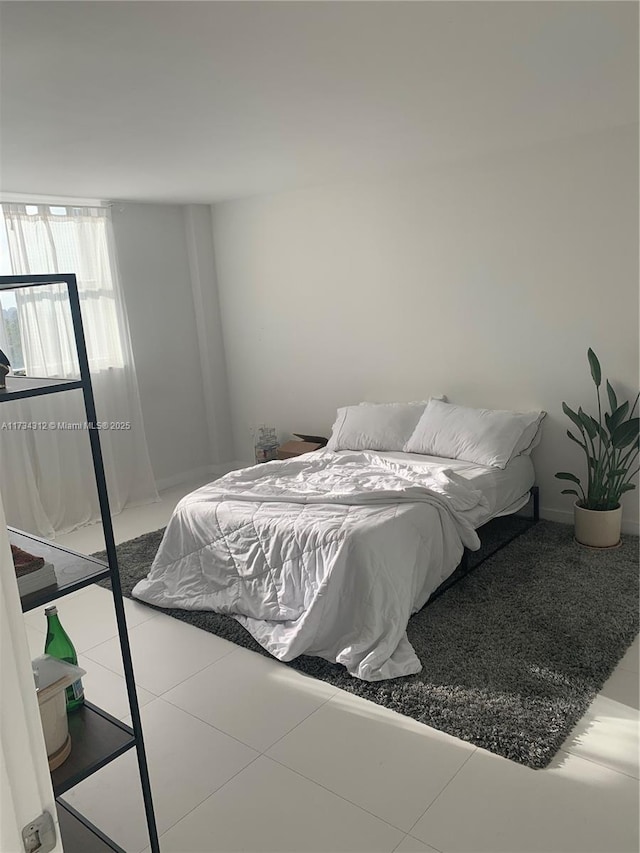 bedroom with tile patterned floors