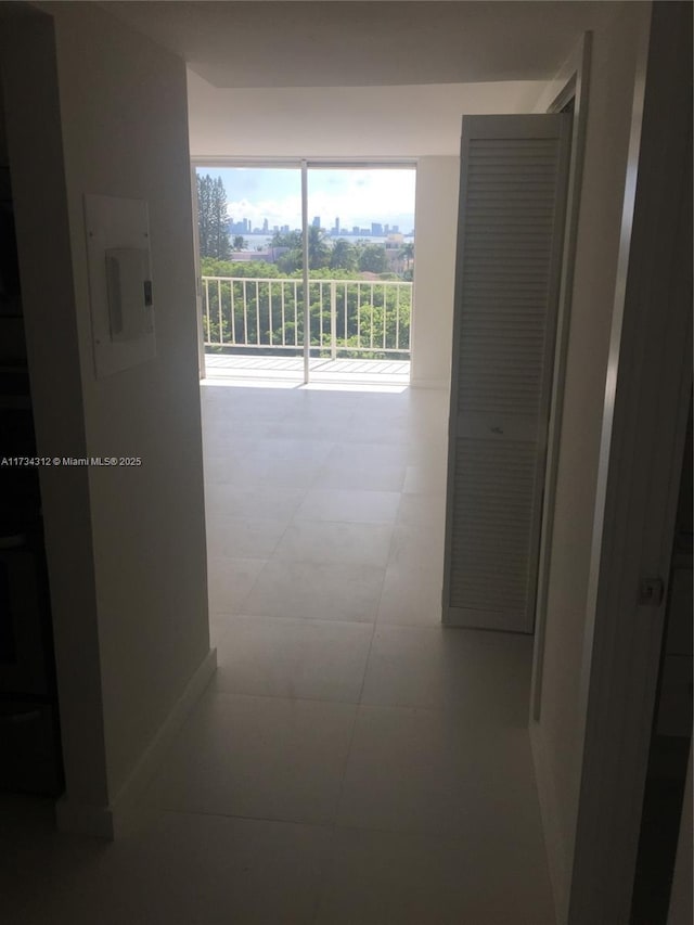 hall with light tile patterned flooring